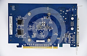 Electronic graphics card board with chips and radio elements. The reverse side of the video card. Transistors and capacitors