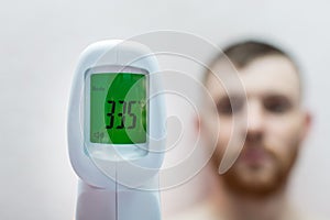 Electronic infrared non-contact thermometer shows low body temperature