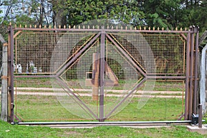 Electronic iron gate with the number four inverted in a tourism farm in the interior of Brazil, South America