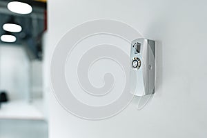 Electronic key access system door lock on the wall.