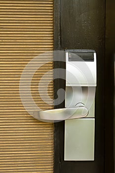 Electronic lock on door with white key card