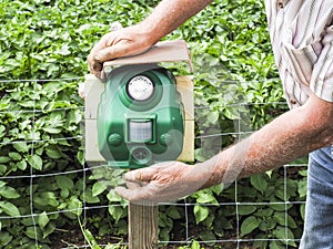 Electronic machine placed in front of a garden to scare away frighten not only birds but wild animals.