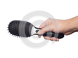 Electronic massage black comb in hand