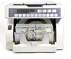 Electronic money counter machine is counting is counting the American hundred-dollar US dollars banknotes