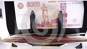 Electronic money counter machine is counting the Russian five-thousandth ruble banknotes.slow motion