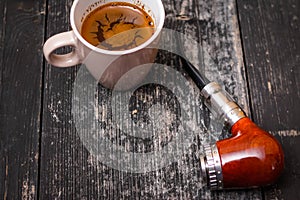 Electronic pipe and cup of coffee