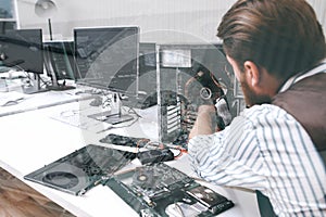 Electronic repairman working , double exposure