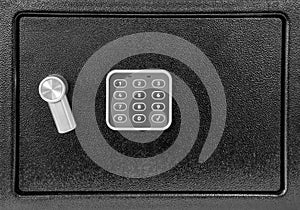 Electronic safe lock with numeric keypad.