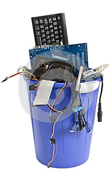 Electronic scrap in blue trash can