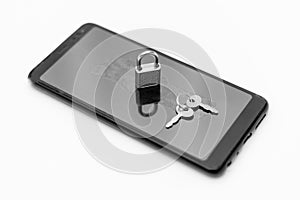 Electronic security and data protection concept. Mobile phone and key lock