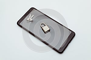 Electronic security and data protection concept. Mobile phone and key lock