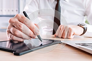 Electronic signature, businessman providing e-signature for document agreement using stylus and pad