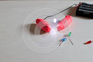 Electronic soft circuits with LEDs, batteries and modeling clay.