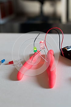 Electronic soft circuits with LEDs, batteries and modeling clay.