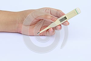 Electronic Termometer on hand. photo