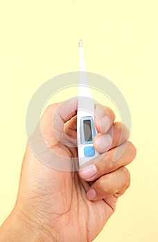 Electronic thermometer in hand