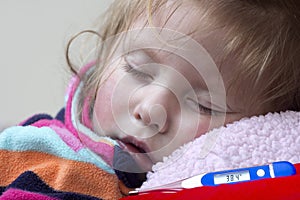 Electronic thermometer and a little sick girl