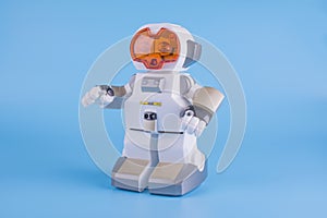 Electronic, toy robot white with orange eyes