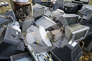 Electronic waste Awaiting recycling. A pile of garbage in nature. Green strategy recycling