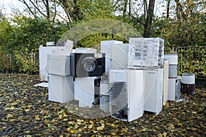 Electronic waste Awaiting recycling. A pile of garbage in nature. Green strategy recycling