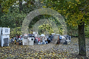 Electronic waste Awaiting recycling. A pile of garbage in nature. Green strategy recycling