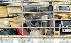 Electronic waste devices stack together Monitor, Printer, desktop computer, fax for waiting to be recycled. Produced from plastic