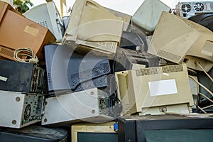 electronic waste stack together Monitor, Printer, desktop computer, fax for waiting to be recycled. Produced from plastic, copper