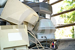 electronic waste stack together Monitor, Printer, desktop computer, fax for waiting to be recycled. Produced from plastic, copper