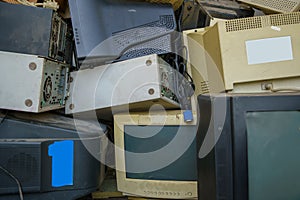 electronic waste stack together Monitor, Printer, desktop computer, fax for waiting to be recycled. Produced from plastic, copper