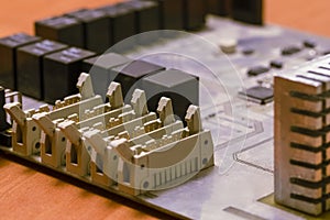 Electronics Concepts. Closeup Macro Shot of Dusty Utilized Printed Circuit Board with Integrated Circuits and Surface Mounted