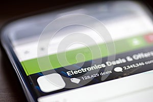 Electronics deals and offers category button link on shopping app on smartphone screen closeup