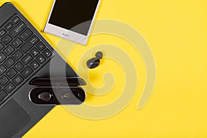 Electronics devices on yellow background