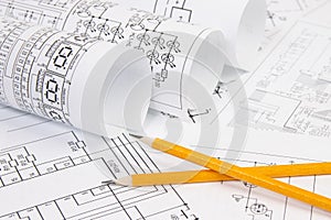 Electronics and Engineering. Pencil on printed drawings of electrical circuits