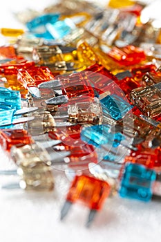 Electronics Ideas. Closeup Shot of Batch of Colorful Fusable External Connectors Placed Bulk On White