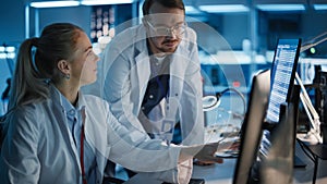 Electronics Research, Development Facility: Engineer Project Manager Consults Scientist working on