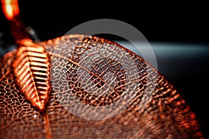 Electroplated orange natural leaf macro