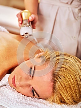 Electroporation therapy stimulation body treatment on woman back