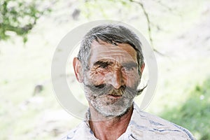 Elederly man with moustaches photo