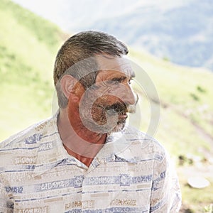 Elederly man with moustaches profile view photo
