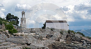 Elefsina Panagia Mesosporitissa old Orthodox Church Belfry over Archaeological Site Attica Greece