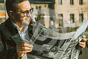 Elegance beauty man in glasses read newspaper