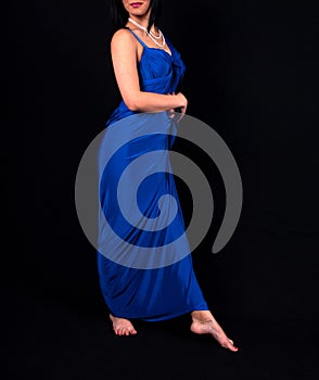Elegance in Blue: Barefoot Woman in a Sleek Electric Blue Dress