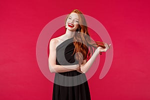 Elegance, fashion and woman concept. Portrait of confident sexy and stylish young redhead woman in red lipstick, evening
