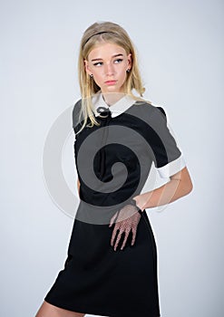 Elegance in simplicity. Fashionable uniform. Vintage and retro style. Vintage fashion concept. Girl blonde wear elegant