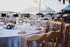 Elegance table set up for wedding in beige. Wedding dinner set up near the sea