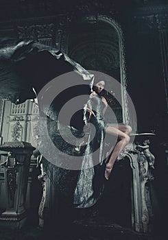 Elegance woman with flying dress in palace room