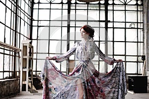 Elegance woman with flying dress in palace room