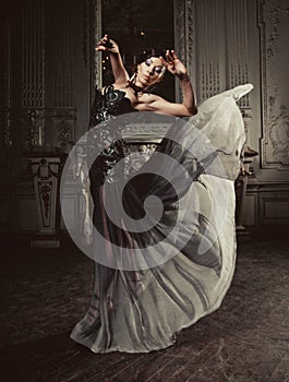 Elegance woman with flying dress in palace room