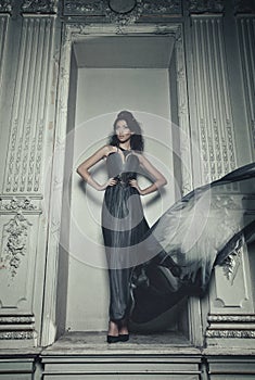 Elegance woman with flying dress in palace room