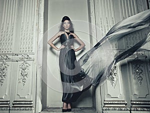 Elegance woman with flying dress in palace room